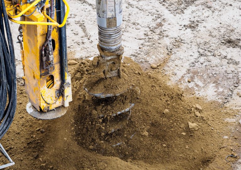 Foundation drilling tool working in soil